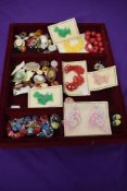 A collection of vintage costume jewellery, to include lucite brooches, Scottie dog brooches with