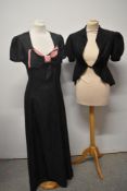 A 1930s Art Deco taffeta dress with pink and black statement bow to bust and a black watered taffeta