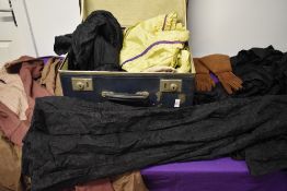 A suitcase of predominantly Victorian clothing, AF, signs of wear.