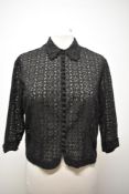 A 1930s black blouse, having twenty two little self covered buttons to the front and 3/4 length