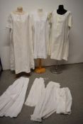 A selection of Victorian and Edwardian white wear, two pairs of bloomers, three shifts and two