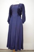 A late 30s/ early 40s navy blue day dress having rushed detail to tapered bodice, full skirt, side