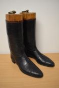 A pair of stack heeled, leather soled gents riding boots with wooden boot trees.