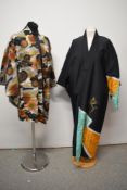 A 1970s Japanese Haori, having abstract design in orange, yellow and red hues, sold with a 1980s