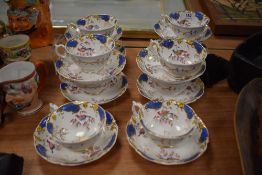 Ten Victorian cups and saucers, having white ground with bird and foliage design and gilt