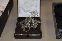 A small selection of silver and white metal jewellery including marcasite necklace, butter fly