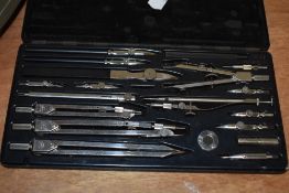 A Swiss made cased draughtsmens set.