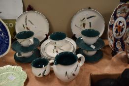 A collection of Denby table ware, including jugs, plates and cups and saucers, having white and