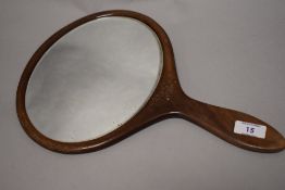 An early 20th century wooden hand mirror, advertising Reslaw hats.