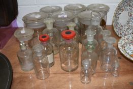 A selection of vintage glass bottles and jars, including apothecary.