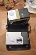 Two retro Philips micro cassette dictation devices.