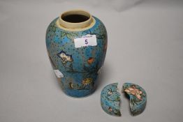 A late 19th century Chinese Cloisonné on porcelain vase, having intricate butterfly and flower
