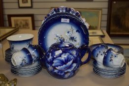 An early 20th century part tea service in a cobalt blue and gilt glaze.