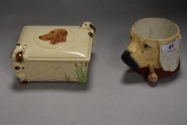 A mid century DBC ware trinket box with relief spaniels to sides and lid, and a novelty pipe smoking