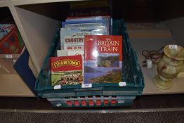 A crate of books of train and rail related interest.