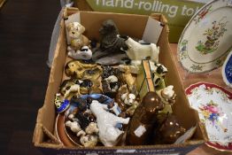 A box of vintage collectable dog ceramics and cast metal studies, including novelty terrier book