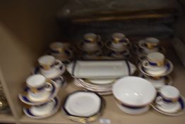 A collection of Alfred Meakin 'Bleu De Roi' table ware, having cobalt blue banding with gilt