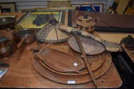 A larger wooden charger, a carved fish formed serving dish, sold with assorted baskets and woven
