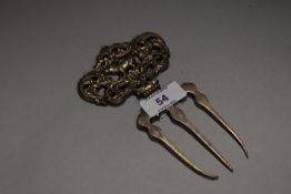 A Victorian bread fork, having pig to centre of moulded filigree handle.
