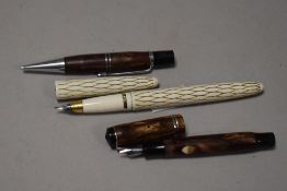 Two vintage fountain pens, one miniature with marbled effect barrel and similar retracting pencil,