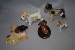 A selection of dog related ceramics, including chalk ware wall hanging terrier, ceramic terrier