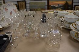 A mixed lot of vintage crystal and cut glass, including etched wine glasses, sugar sifter, liquor