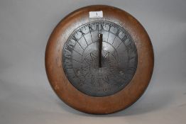 A vintage sun dial, mounted on mahogany base.