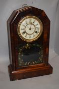 An early 20th century American mahogany cased wall clock, having painted detailing to glass door,