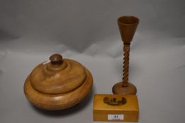 A trio of treen, to include turned bowl with lid sat aloft three feet, a vessel with twist stem
