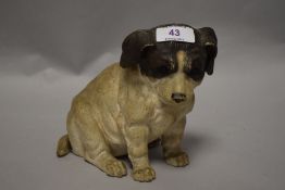 A mid century chalk ware puppy dog, having mournful expression and 1895 impressed to base.