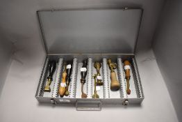A collection of vintage and antique pastry jiggers, including double wheeled, brass examples and