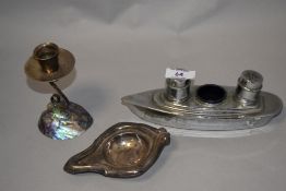 A mid century New Zealand paua shell candlestick, a plated strainer and a vintage novelty ship