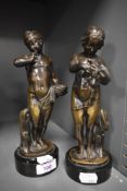 A pair of 19th century cold painted bronze or bronze effect studies, on black natural stone bases, a