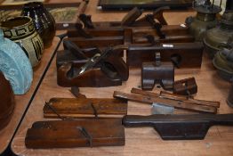 A collection of vintage and antique cabinet makers wood working planes.