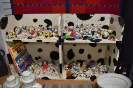 A bookcase containing the complete collection of Disneys 101 Dalmations toys, McDonald collection.