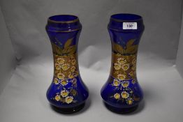 Two Victorian blue glass vases, having enamel daisy design, AF, some wear.