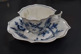A Meissen porcelain white onion pattern cup and saucer, crossed swords mark to base
