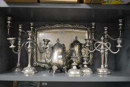Six vintage candlesticks, a tray with ornate border and handles, a coffee pot and a tea pot.
