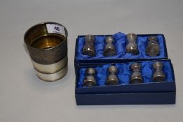Two boxes of miniature plated cruet sets and a vintage stirrup cup.