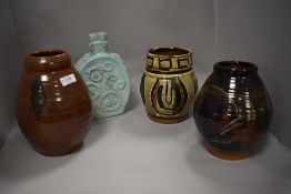 Four studio pottery vases including two mid century terracotta ground with abstract decoration.