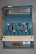 A mid century Codeg child's toy till.