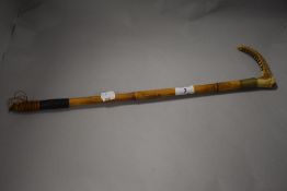 An early 20th century horn handled riding crop, having Eve Cook monogrammed to cuff.