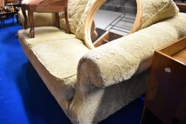 A cream upholstered settee , possibly Tetrad