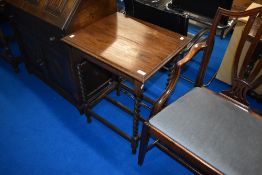 An early 20th Century oak occasional table with barley twist frame