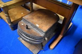 An antique forge or similar bellows