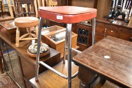 A vintage chrome frame kitchen stool