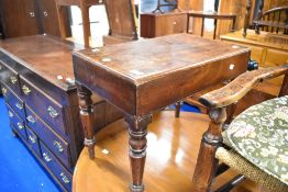 A Victorian mahogany baby bath , having turned legs