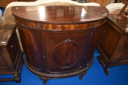An early 20th Century mahogany bow fronted side cabinet