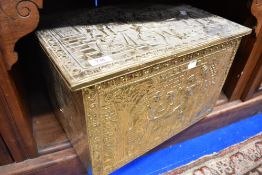 A traditional brass slipper box