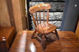 A traditional child's kitchen chair